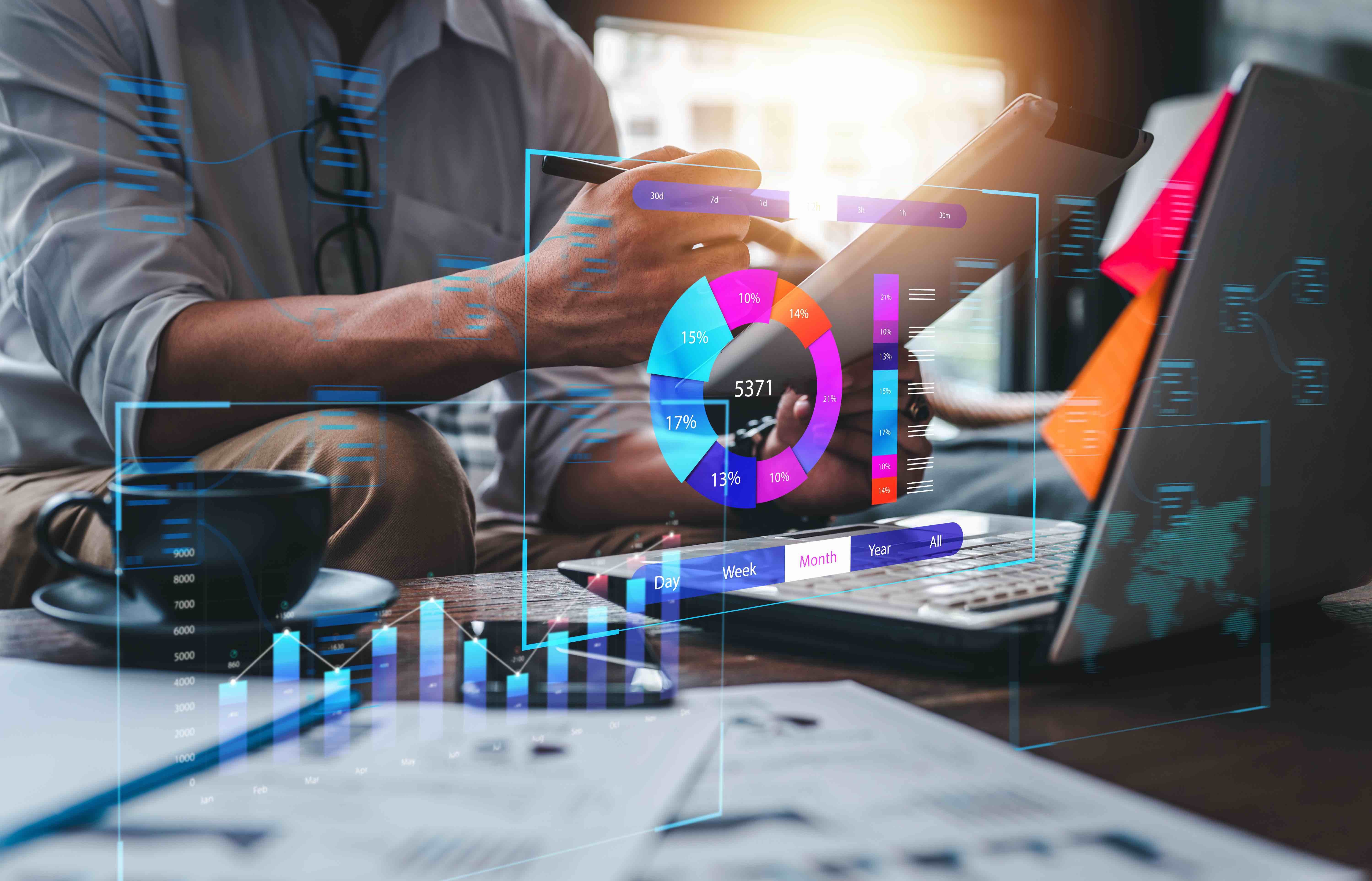 person at desk with kpi graph and chart graphics