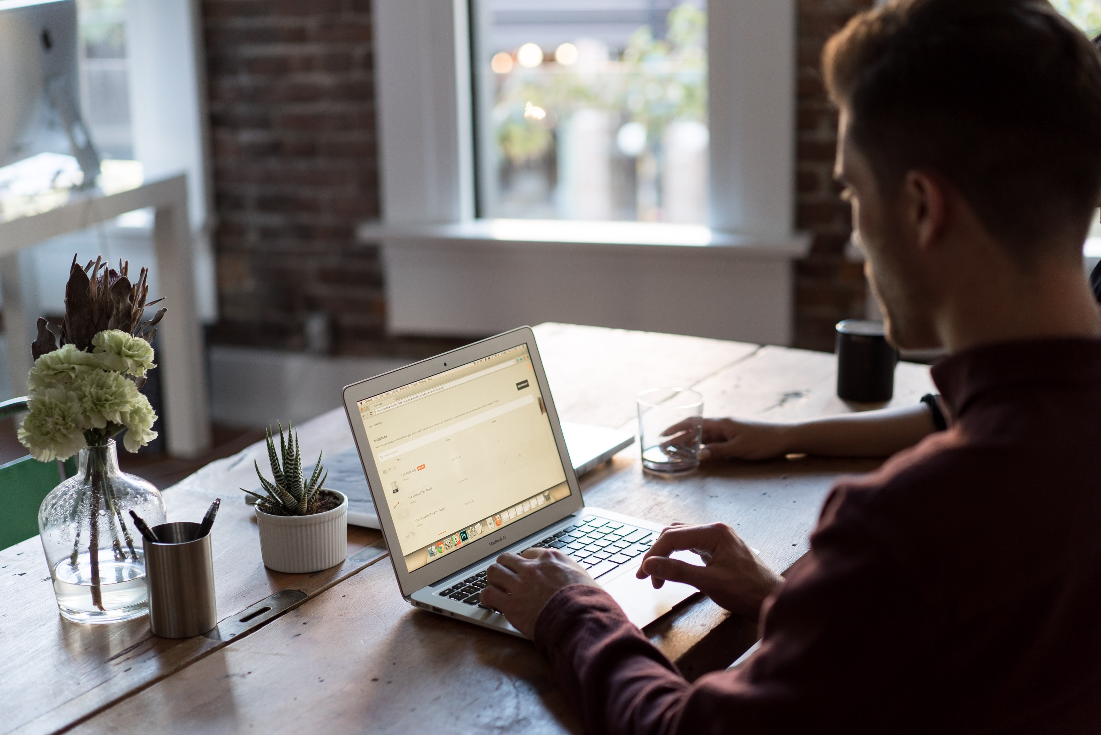 Someone looking at a laptop and typing Photo by Bench Accounting on Unsplash